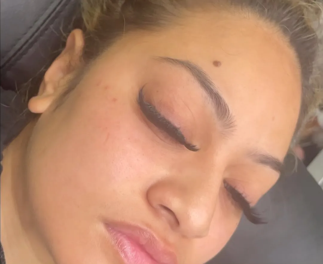 Sharp graphic-liner lash line on a closed eye