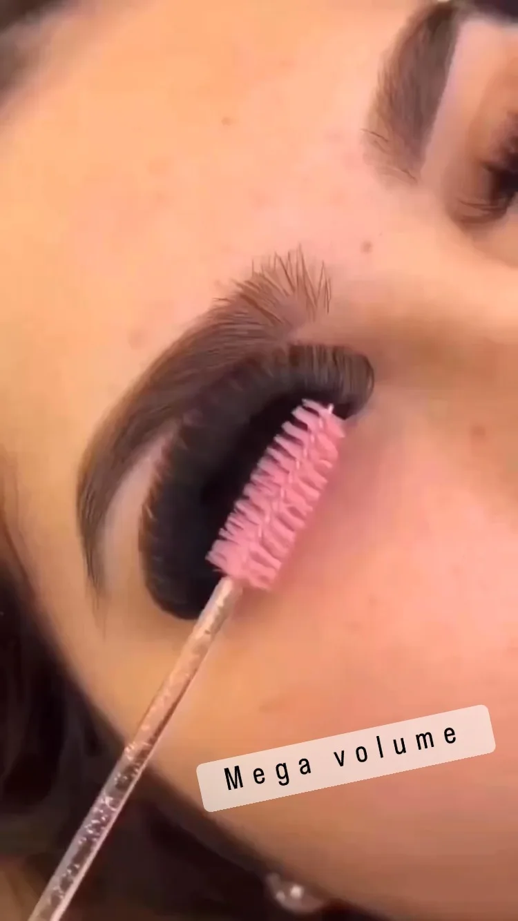 Mega volume fan being groomed with a pink spoolie