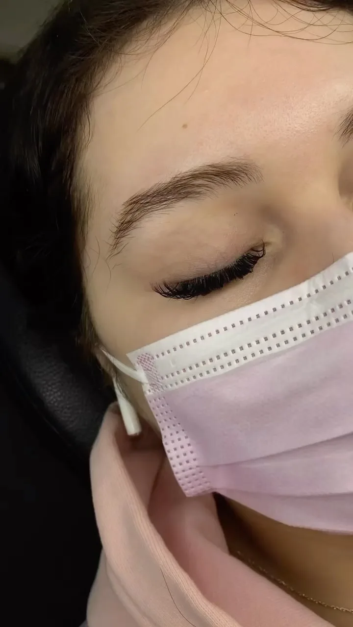 Side profile — volume lashes, pink surgical mask