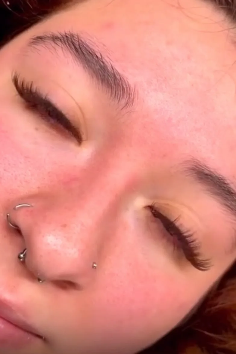 Natural lash result — freckled face, silver nose ring